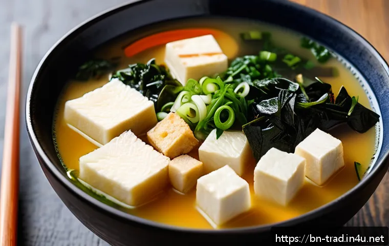 된장 - A vibrant and detailed close-up of a traditional Japanese miso soup bowl on a rustic wooden table, f...